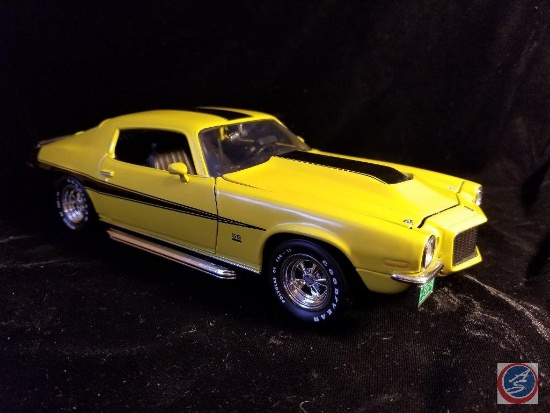 Die cast Camaro, yello in color with red racing stripes
