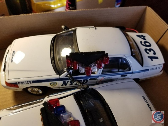 (2) NYC Police Foundation cruisers, with some damage. Run on batteries