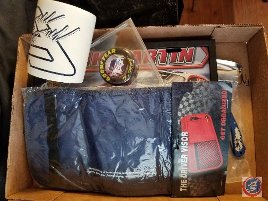 Flat containing Mark Martin license plate, fishing lure, knife, and more