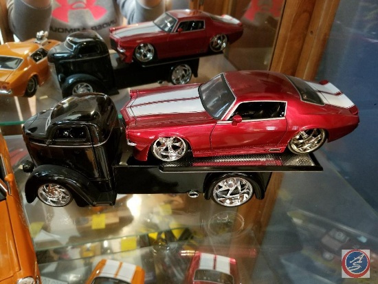 1947 die cast black Ford COE truck with Camaro on trailer