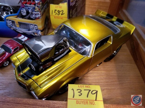 1971 die cast Camaro funny car, gold in color with black racing stripes