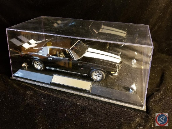 Ertl die cast Camaro, black in color with white racing stripes, in show case box
