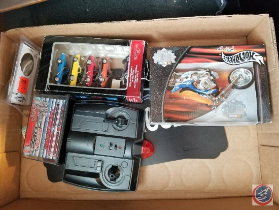 Flat containing Hot Wheel motorcycle, Nascar cars, Camaro Six license plates and covers, etc