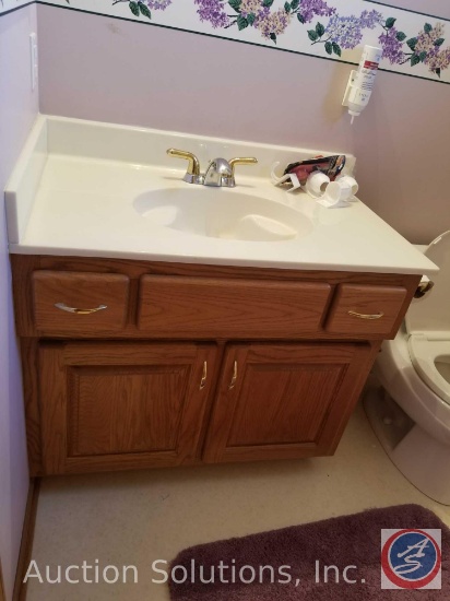 Salvage rights to Bathroom (closest to garage) including Sink, Toilet, and Wall Lighting. Vanity