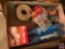 Flat containing shelf grippers, packing tape, pot magnet, and more