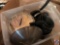 Tote containing stock pot with lid, sauce pans, and some lids