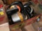 Box containing a variety of cake pans, skillets, and more