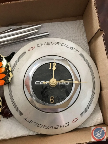 Camaro hubcap cover clock and a butterfly Windchime