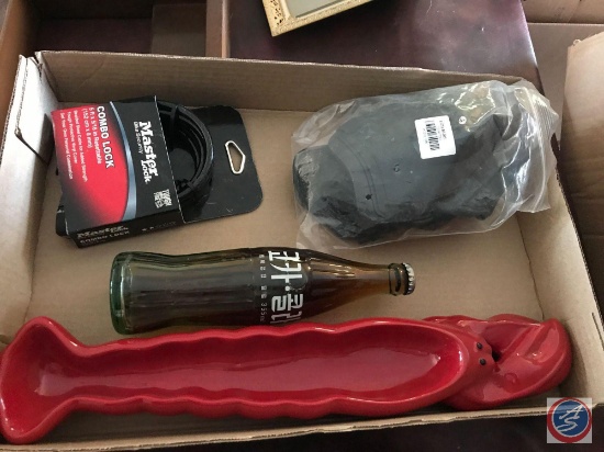 Master Lock 5ft. combo lock, a Japanese Coca-Cola bottle, a lobster tray and go pro doggie camera
