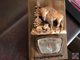 Motivational sign, vintage postcards, photo albums and Yellowstone national park buffalo thermometer
