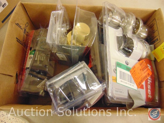 Box containing packages of door knob and lock hadware