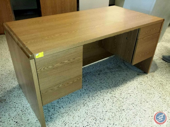 Light brown desk w/ [5] drawers measuring 5ftx2.5ftx2.5ft