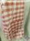 (1) Red/White Checkered Tablecloth, Round Measuring 108 inches in Diameter.