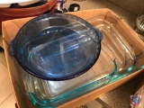 4 Pyrex cake pans and a blue pie pan