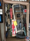 Flat containing clamps, screwdrivers, shims, saws, drill bits, and more