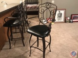 4 metal barstools 29 inches to seat, with arms and backs. Times the money