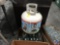 U-Haul propane tank, new and (9) propane bottles