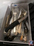 Silverware sorter containing plastic utensils, and a box of Hilton motel silver plate flatware