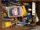 Assorted allen wrenches, tie down straps, sockets, screws, slime, air pressure gauge, and safety