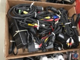 (2) boxes of assorted cords and a black light