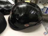 (3) motorcycle helmets. One has a faceguard, another skull d?cor