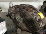 Camo backpack containing duct tape, travel kit etc. Waterproof