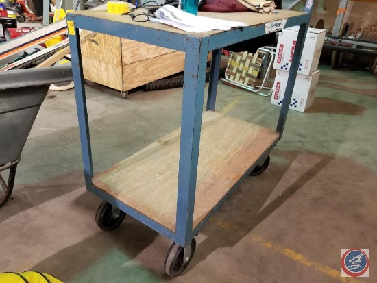 Two tiered metal rolling cart with wood shelves, approx. 4 feet in height