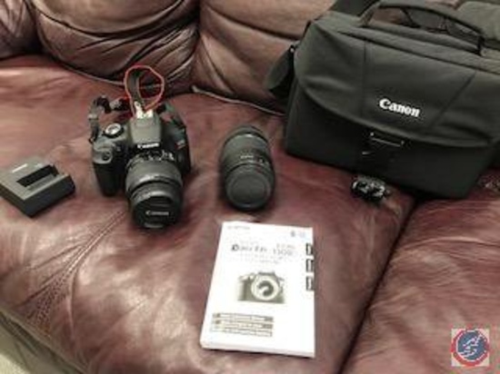 Canon EOS Rebel T6 camera with telephoto lenses and carrying case.