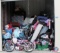 10x10 unit containing children's bicycles, Sanyo flat screen TV, vacuum, luggage, mattress and box
