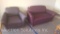 Maroon love seat and a purple and black striped chair