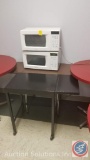 Two small Samsung microwaves, folding table, 8 foot folding table, coffee maker, and a whirlpool ice