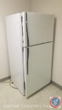 Emerson microwave, two 4 x 6 wooden shelving units and an RCA refrigerator freezer