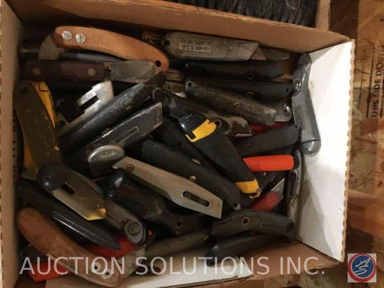 Flat containing assortment of box cutters