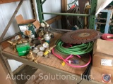 Assorted welding gauges and regulators, [2] extension cords and contents of shelf