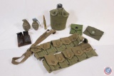 2 practice grenades, 50 cal shell, canteen, magazine and map pouches.