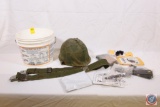 Bucket that contains: Military helmet Web belt stripper clip parts