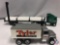 (2) Die cast cars: ERTL silver Tyler transport truck w/ grain feeder, ERTL green Tyler transport