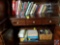 Contents of 2 shelves to include assorted books, office supplies, envelopes and Realistic telephone