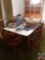 6' wood dining table, (6) matching chairs (some with cushions), protective table cover- (1) extra
