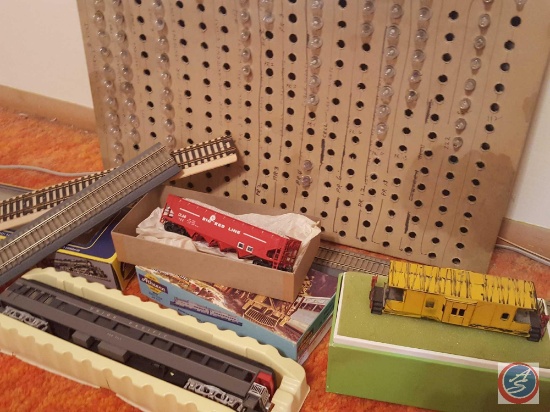 Assorted model train light bulbs, train yard accessory props, MRC sound decoder electrical train