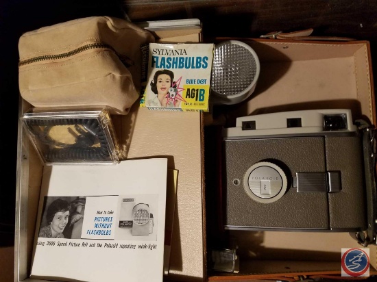 Vintage Polaroid 800 camera with cords, flash, Sylvania flashbulbs, manual, carrying case and more