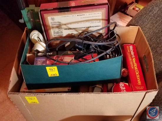 Box containing a corded home phone in original box, various cords, Webster's New World Dictionary,