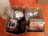 (2) boxes containing; (2) cast iron skillets, can opener, pot, apple peeler/corer/slicer, assorted