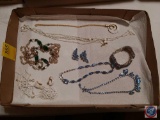 Flat of assorted costume jewelry