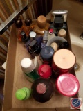 Assortment of partially used hygiene items including mens colognes, shaving cream and more