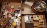 (2) flats containing an assortment of buttons, stampers and a tin of pins