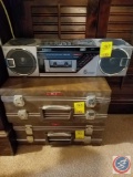 Sanyo AM/FM 6 speaker cassette player (model #M7740), (1) empty cassette carrying case, (1) cassette