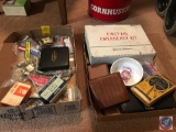 2 flats containing a first aid kit, sheriff's badge, Navy Patches, cat food bowl, variety of pins,
