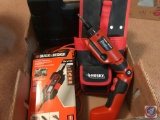 Box containing Husky tool holder, Black & Decker Battery Maintainer, Drill Bit Set in case