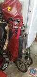 Scovill golf bag on Ajay play mate golf caddy with (7) assorted golf clubs, umbrella, golf balls,